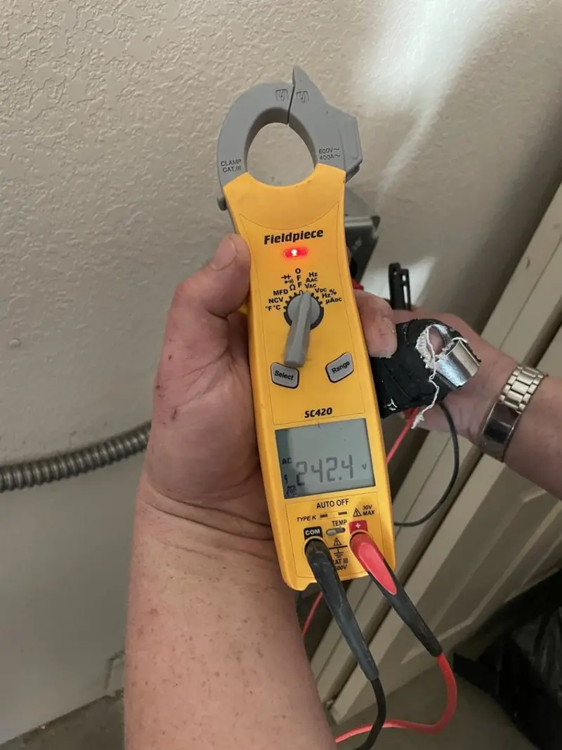 Voltage testing with clamp meter during Whole House Surge Protector in Deale